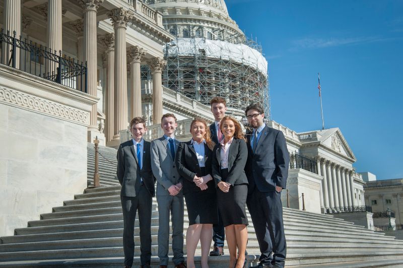 students standing together in Washington in business clothing